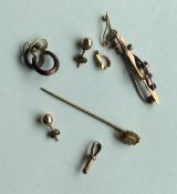 A small selection of 9 carat stick pins and brooch