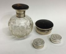 A pair of silver pill boxes together with a tortoi