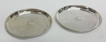 A pair of Edwardian circular silver pin dishes. Bi
