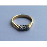 A good diamond three stone ring in 18 carat and pl