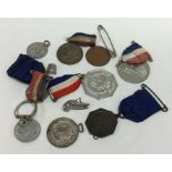A small collection of Military medals and badges.