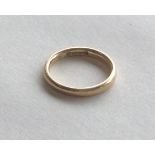 A 9 carat plain wedding band. Approx. 2.8 grams. E