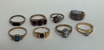 A group of eight 9 carat gem set rings. Approx. 18