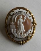 An oval shell cameo depicting a religious scene in