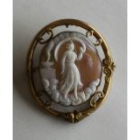 An oval shell cameo depicting a religious scene in