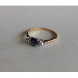 An 18 carat sapphire and diamond three stone ring