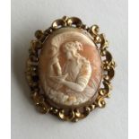 An attractive oval cameo of a lady in gold frame.