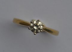 A diamond single stone ring in 18 carat two colour