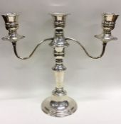 A silver candelabra with bead work decoration. Lon