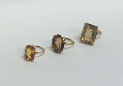 Three heavy 9 carat single stone rings. Approx. 20