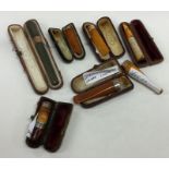 A selection of silver and gold mounted cigarette h