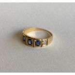 A sapphire and diamond five stone gypsy set ring i