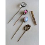 An Antique pearl and red stone stick pin together