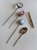 An Antique pearl and red stone stick pin together