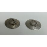 A pair of unusual silver novelty menu holders in t