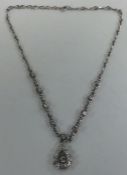 A good heavy 18 carat white gold diamond necklace