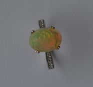 A good faceted opal single stone ring of good colo