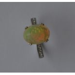 A good faceted opal single stone ring of good colo