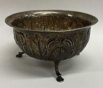 An Irish silver sugar bowl decorated with flowers