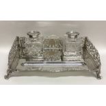 An attractive Edwardian pierced silver inkstand on