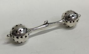 A modern silver rattle with pierced decoration. Ap