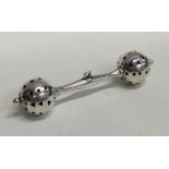 A modern silver rattle with pierced decoration. Ap