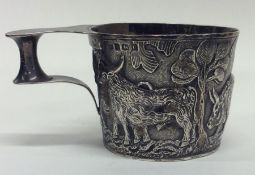A stylish heavy silver cup decorated with figures