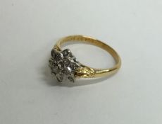 An 18 carat diamond cluster ring in the form of a