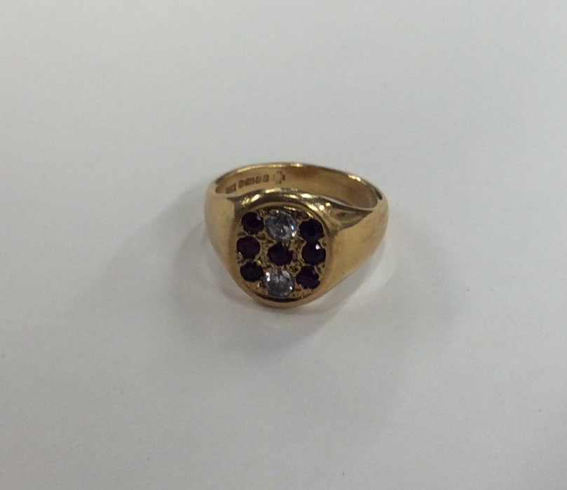 An 18 carat gold gent's signet ring inset with rub