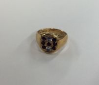 An 18 carat gold gent's signet ring inset with rub