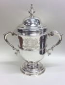 A rare George II silver two handled cup and cover