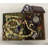 A box containing beads and other costume jewellery