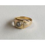 An 18 carat diamond single stone gypsy set ring in