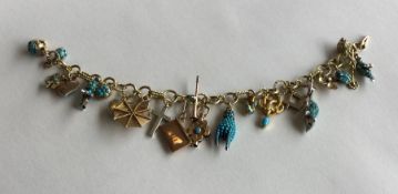 A good quality Antique gold charm bracelet attract