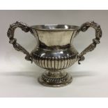 A heavy Georgian silver half fluted campana shaped