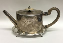 A good Georgian oval silver teapot with bright cut