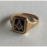 MASONIC: A 9 carat gold ring with swivel mount. Ap