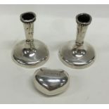 A pair of modern silver candlesticks together with