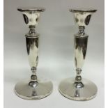 A pair of modern silver circular candlesticks. Bir
