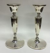 A pair of modern silver circular candlesticks. Bir