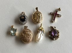A group of 9 carat gem set pendants and lockets. A