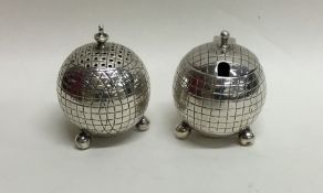 An unusual novelty silver two piece cruet in the f