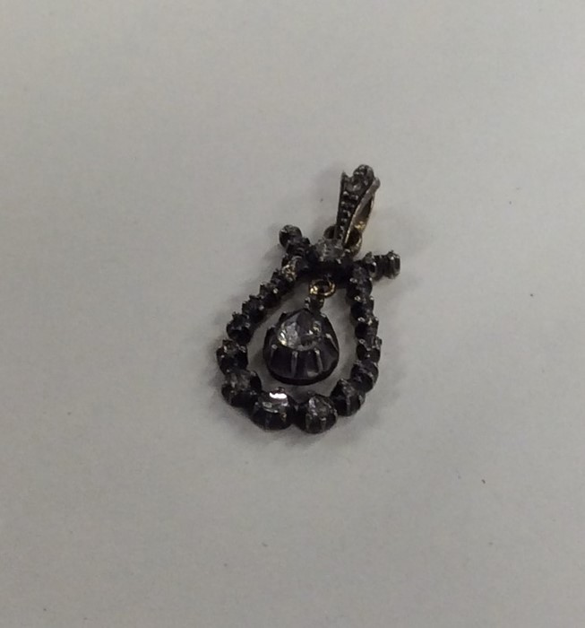 A Georgian rose diamond drop pendant with matching