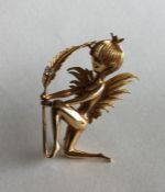 A heavy 18 carat brooch in the form of a fairy wit