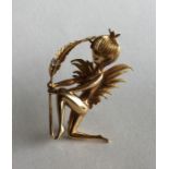 A heavy 18 carat brooch in the form of a fairy wit