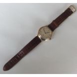 A gent's 9 carat Longines wristwatch with subsidia