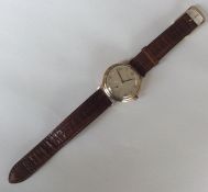 A gent's 9 carat Longines wristwatch with subsidia