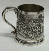 An early Georgian silver mug profusely decorated w