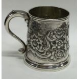 An early Georgian silver mug profusely decorated w
