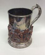 A good silver plated tankard profusely decorated w